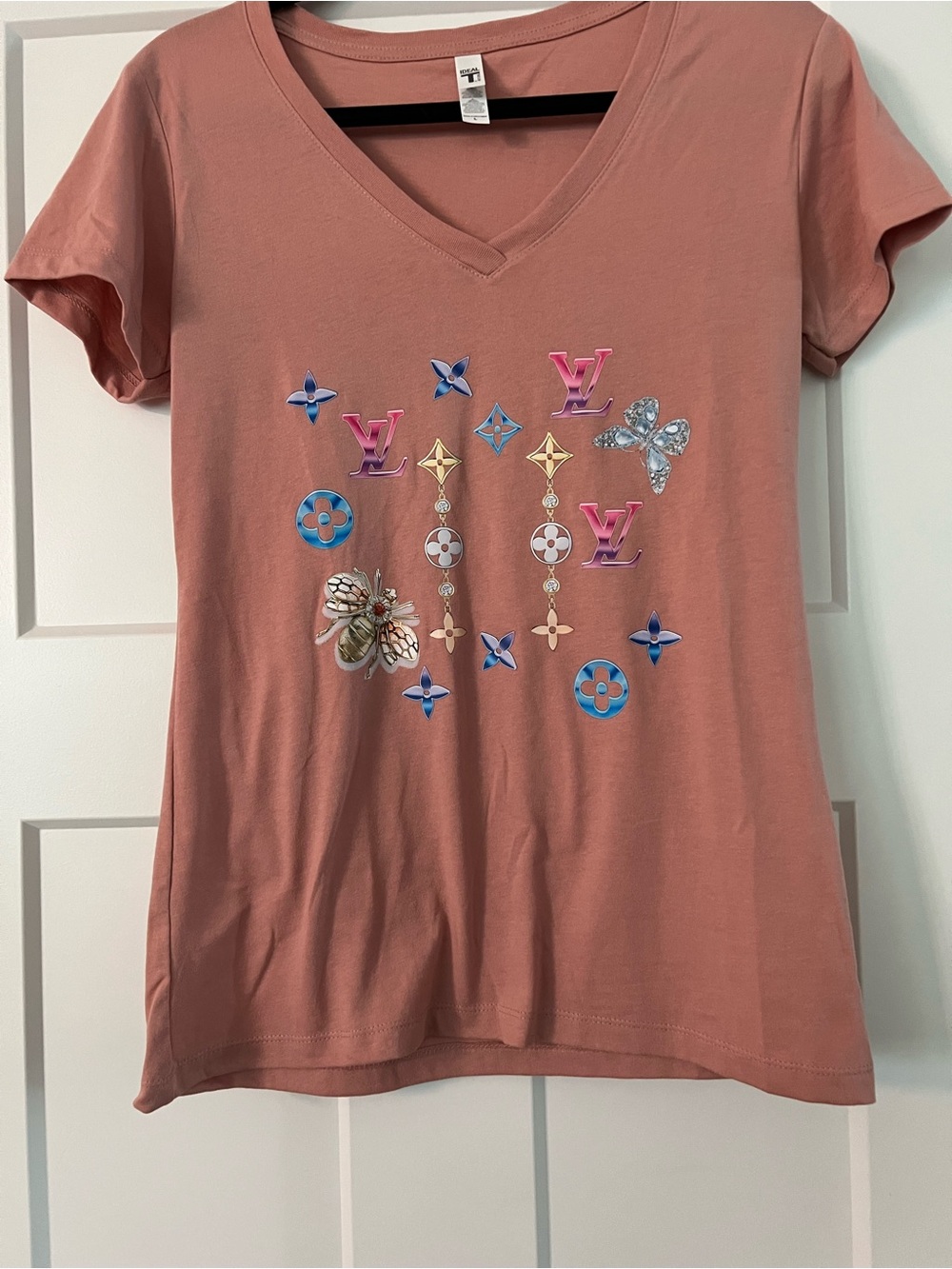 Women's V-Neck Graphic Tee in Dusty Rose with Embellished Motifs